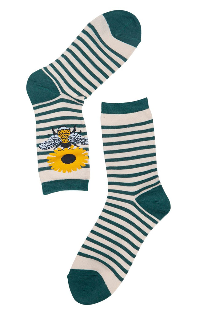 green and cream striped bamboo socks with a flower and bee emblem on the ankle