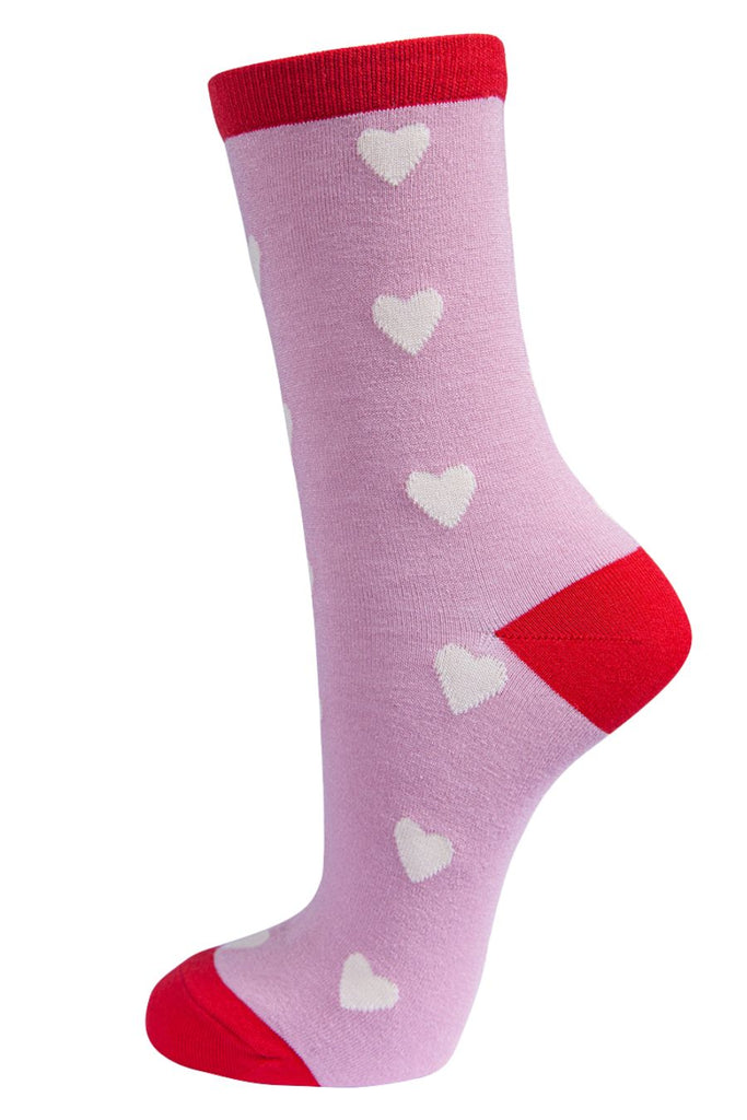 pink bamboo socks with red heel, toe and cuff with an all over pattern of white love hearts