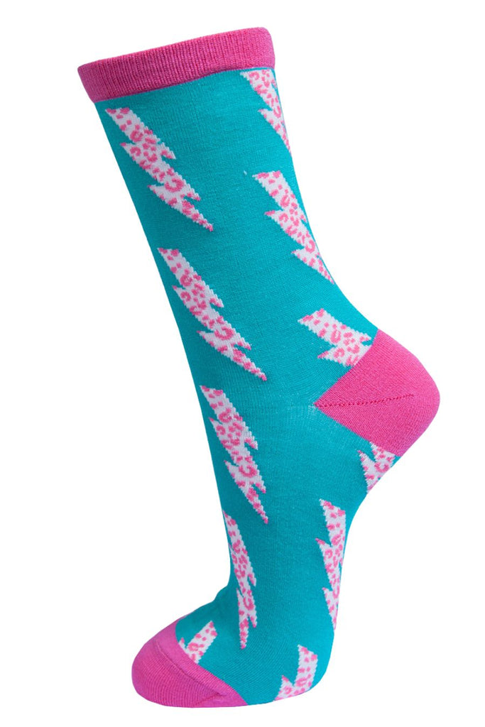 electric blue ankle socks with fuchsia pink heel, toe and cuff with a white and pink leopard print lightning bolt pattern