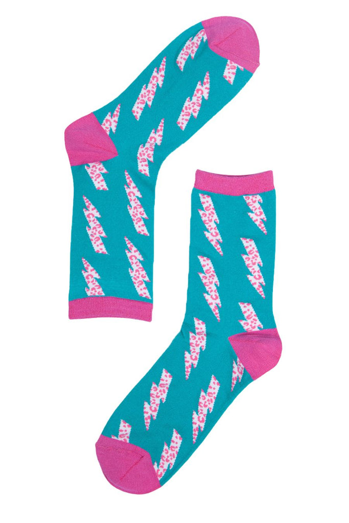 close up of the blue socks with the pink and white lightning bolt pattern