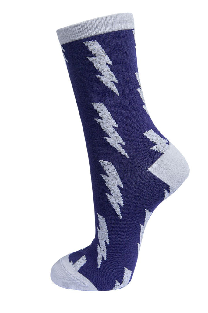 navy blue ankle socks with a light grey heel, toe and cuff with a grey leopard print lightning bolt pattern