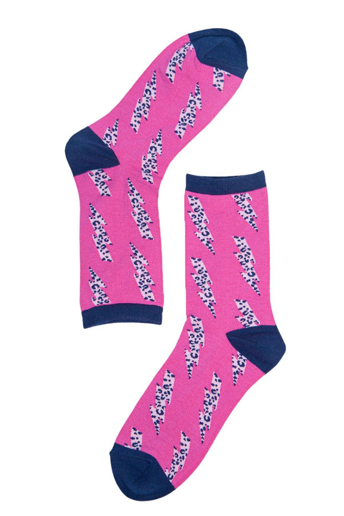 close up of the pink socks with the navy blue and grey lightning bolt pattern