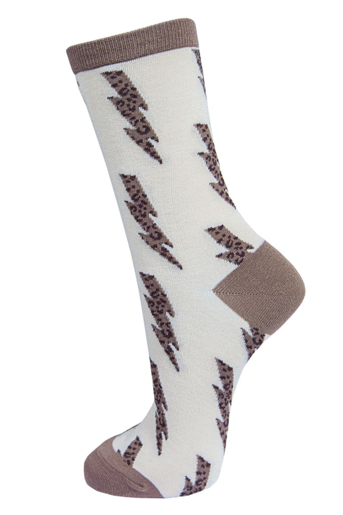 cream ankle socks with a beige heel, toe and cuff with a neutral beige leopard print lightning bolt pattern