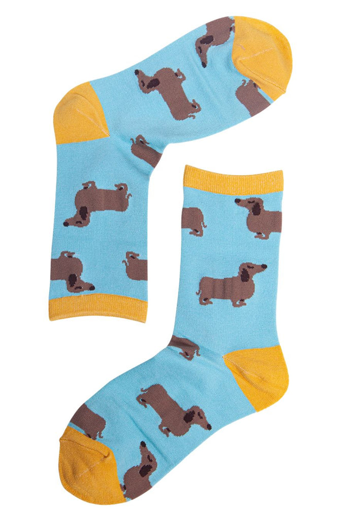 close up of the sausage dog pattern on the blue and yellow ankle socks