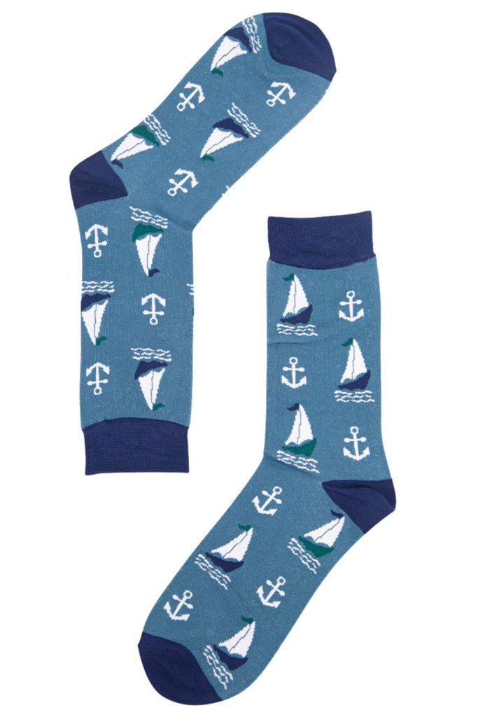 blue socks with an all over pattern of sailing boats and anchors