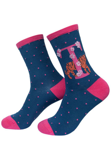 navy blue socks with a large letter t, a tiger and a floral pattern on the ankle