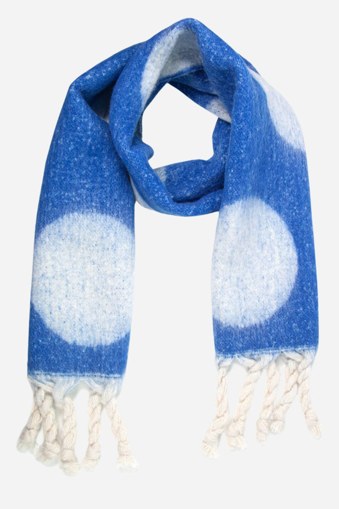 royal blue winter scarf with large white dots and a white tassel trim