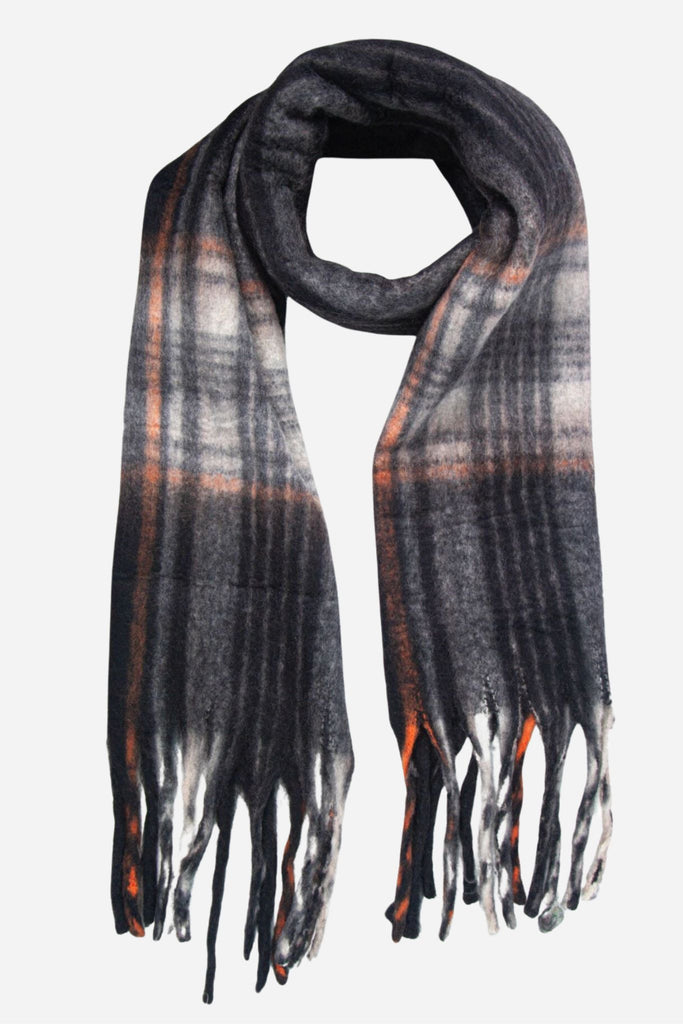 a black and orange tartan pattern winter scarf with tassel trim