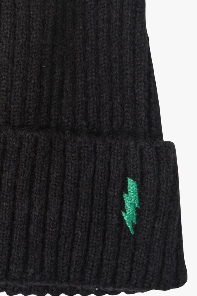 close up of the green embroidered lightning bolt and ribbed knitted fabric