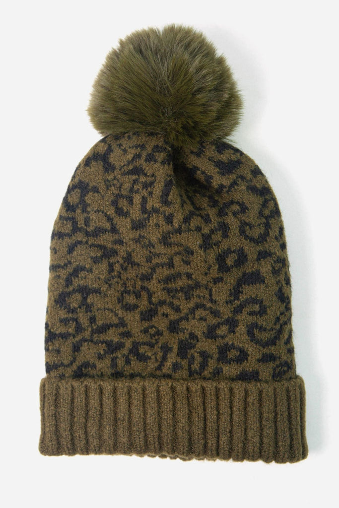 khaki green pom pom bobble hat with an all over animal print pattern