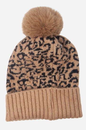 neutral camel coloured animal print winter pom pom hat