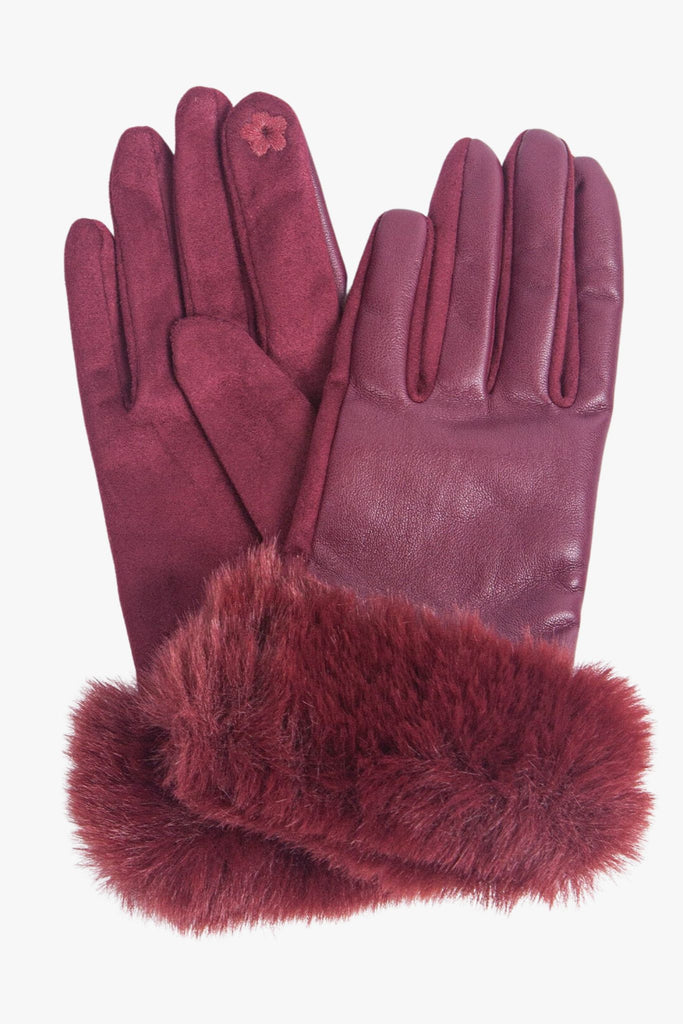cranberry red faux leather gloves with a faux fur trim around the wrist
