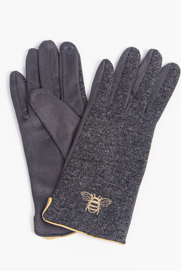 dark grey winter gloves with an embroidered gold bee on the wrist