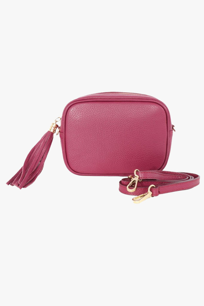 a deep berry pink italian leather handbag with a matching detachable bag strap