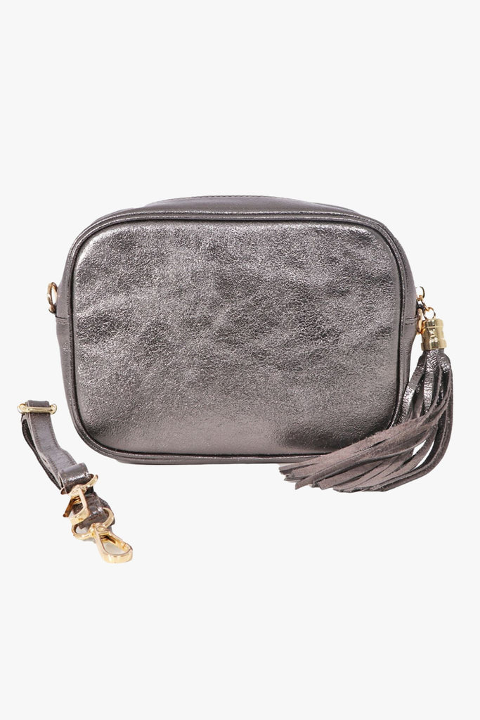 a gun metal grey metallic crossbody camera bag with detachable bag strap