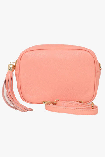 salmon pink leather crossbody camera bag with matching detachable bag strap