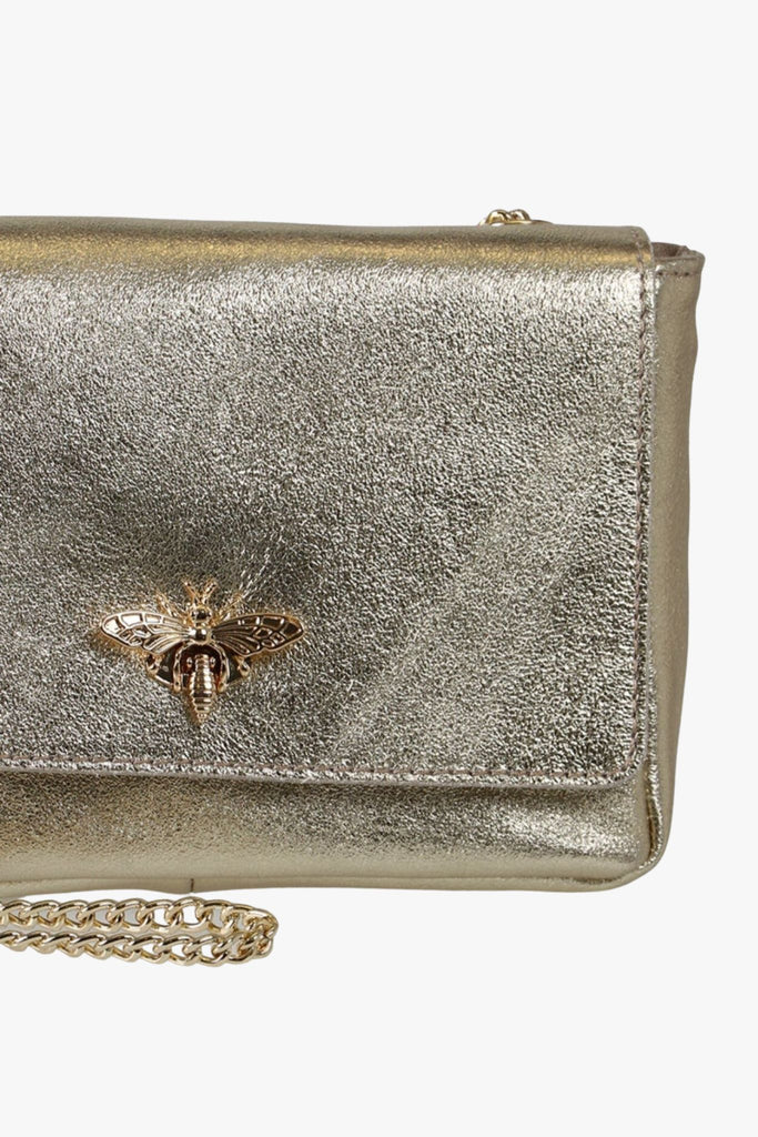close up of the gold leather and bee clasp
