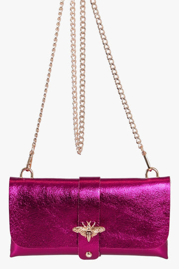 metallic pink leather clutch bag with detachable gold chain strap and gold bee clasp on the front