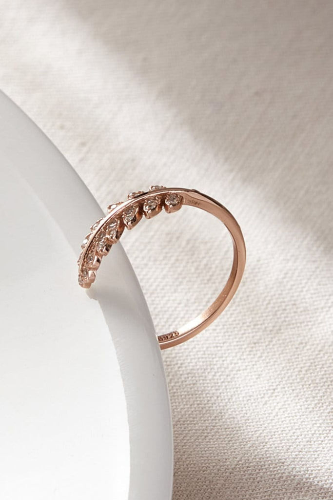close up of the rose gold leaf ring, showing the multiple clear cz stones which make the leaf part sparkle