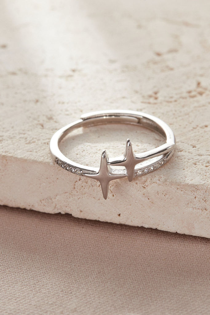 laying flat, showig the double star design and the sparkly cubic zirconia stones