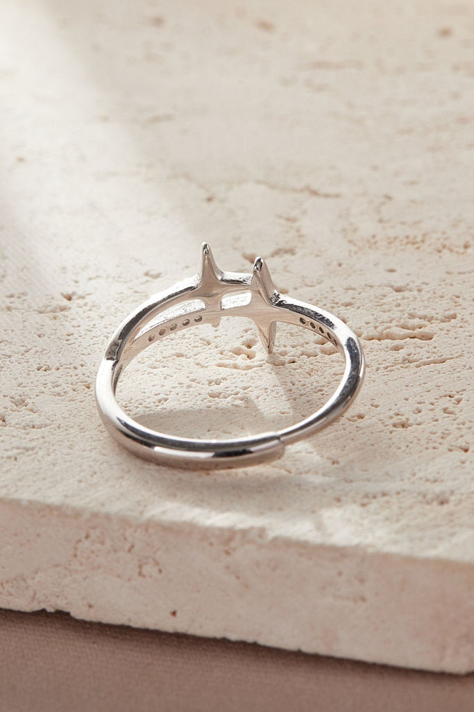 laying flat, showing the inner rim of the ring and the adjustable band