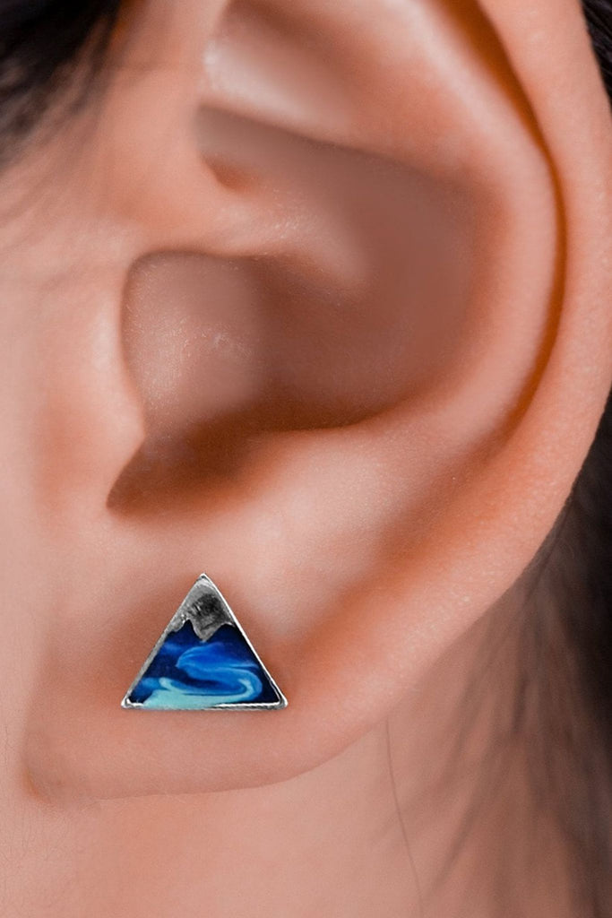 a close up showing the earring being worn on the earlobe