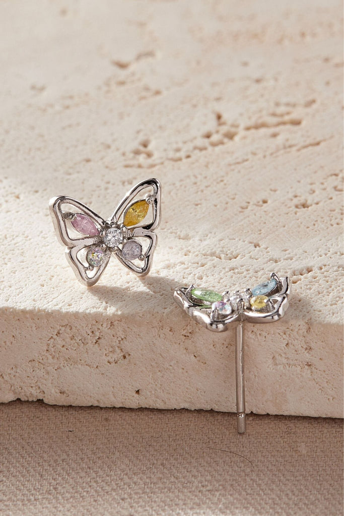 a close up of the butterfly earrings, showing the multicoloured crystals which make up the wings