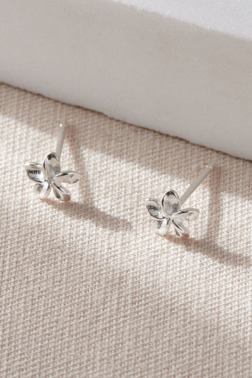 a pair of sterling silver flower stud earrings, a five petal floral design