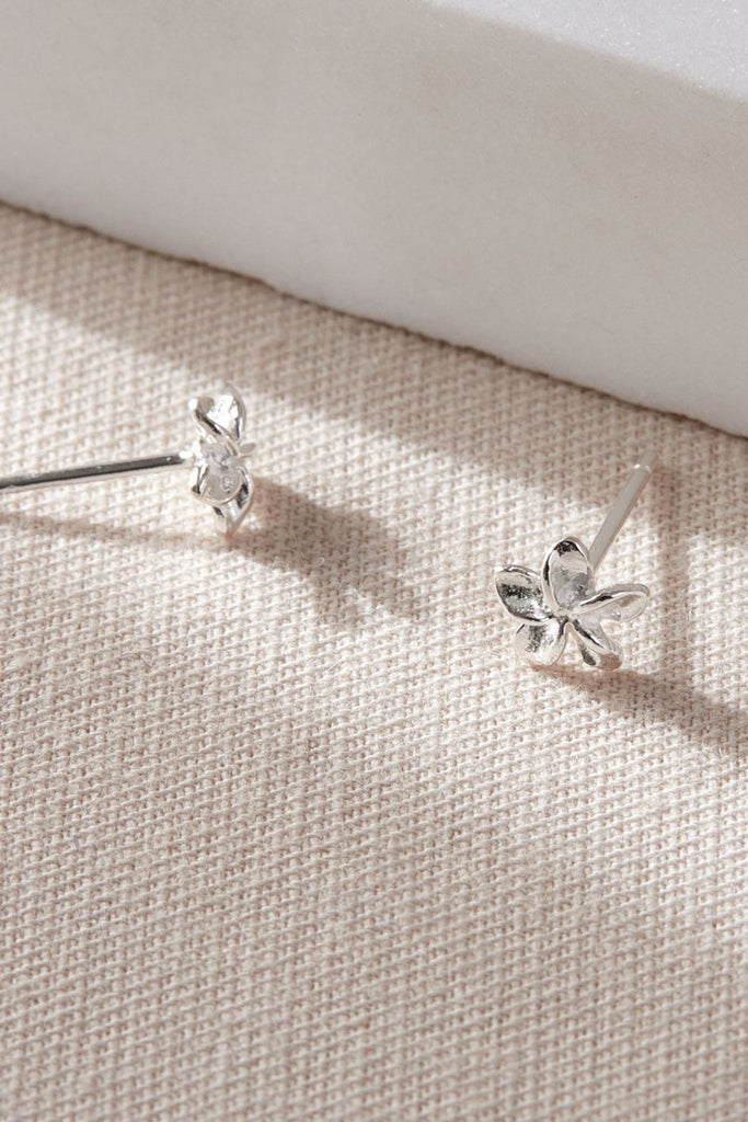 showing a close up of the earrings and side view