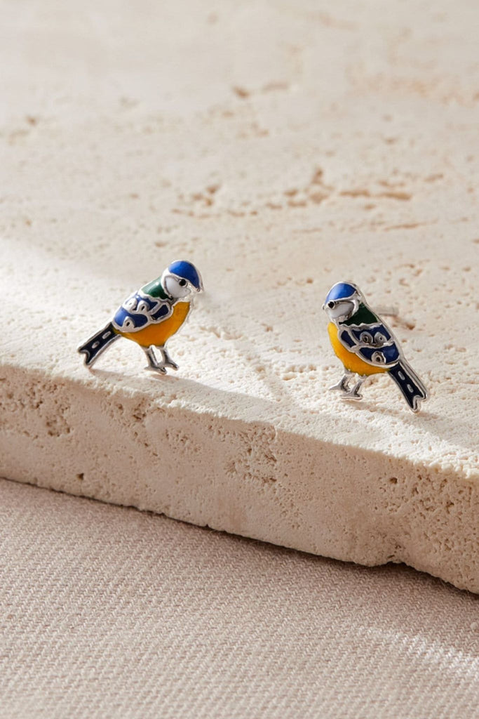 close up of the silver blue tit stud earrings, showing the desgin of the studs