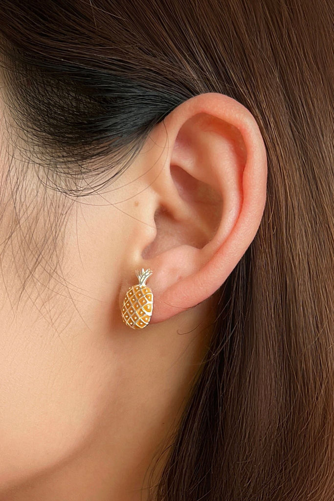 showing the silver colour option being worn on the earlobe