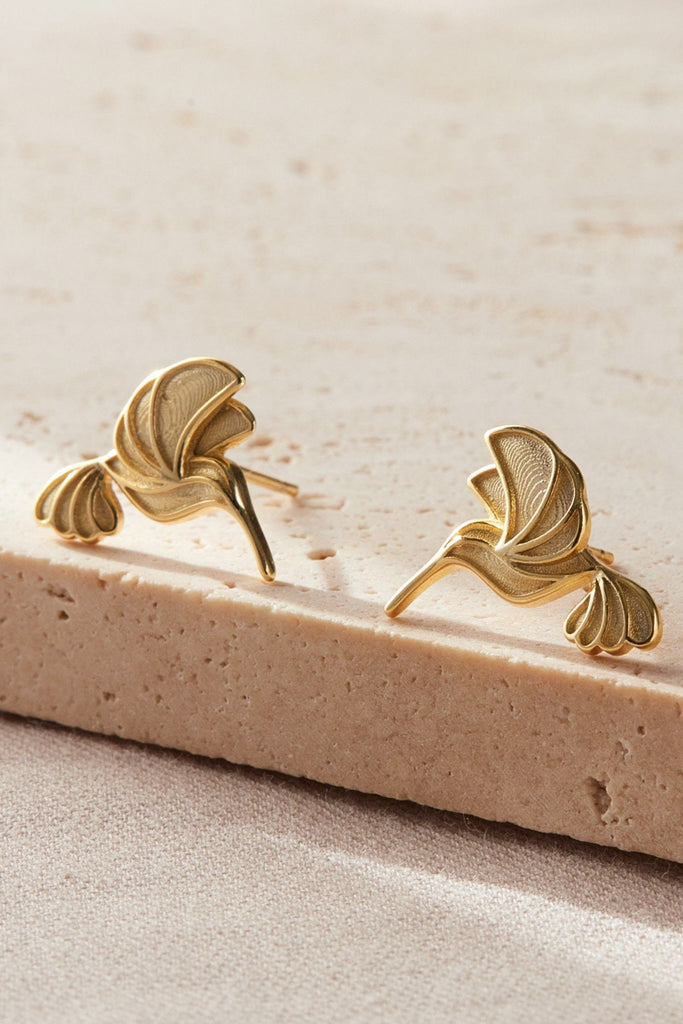 close up of the gold hummingbird earrings