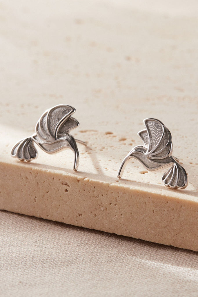 close up of the silver hummingbird earrings