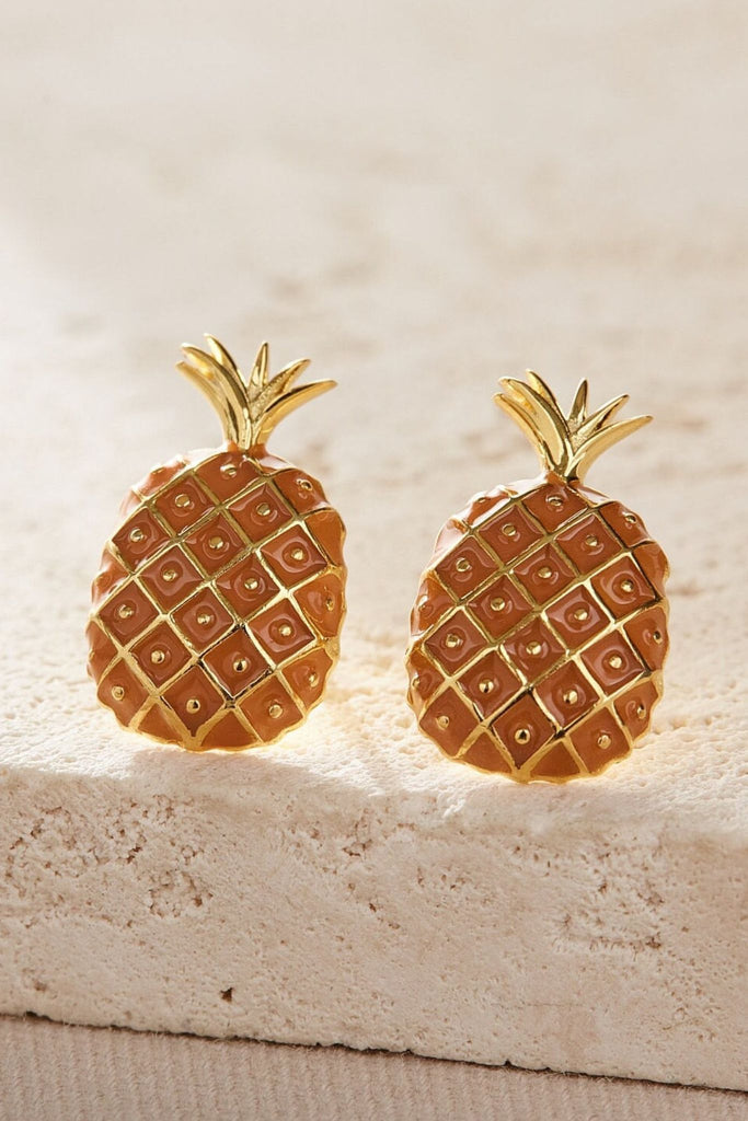 close up of the gold pineapple studs, showing the detail of the design