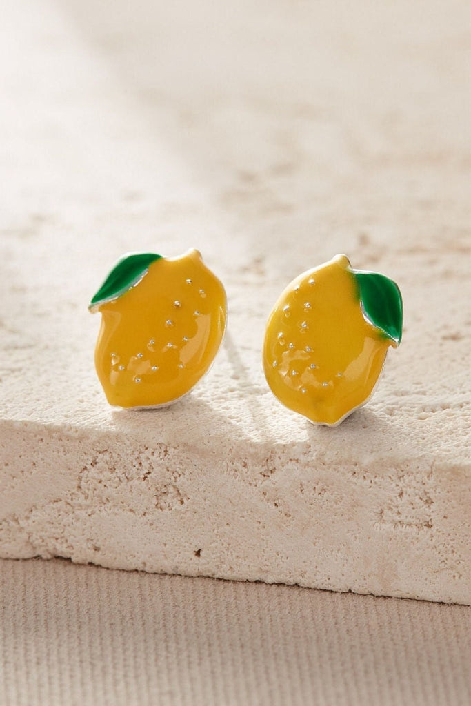 close up of the silver lemon stud earrings, showing the design details