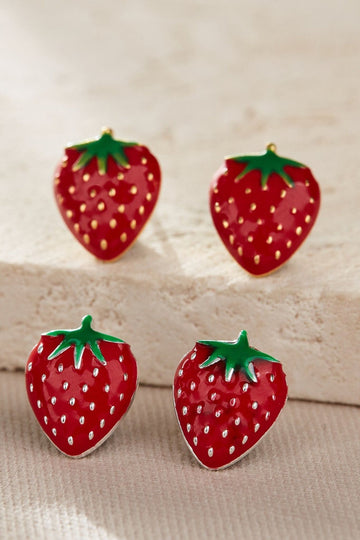 showing both gold and silver designs of the strawberry stud earrings