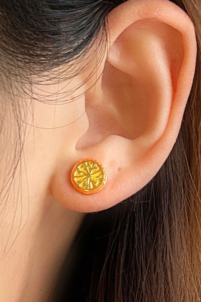 gold colourway being worn on the earlobe