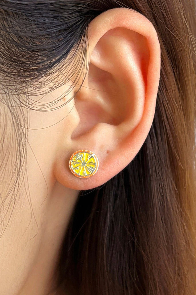 silver colourway being worn on the earlobe