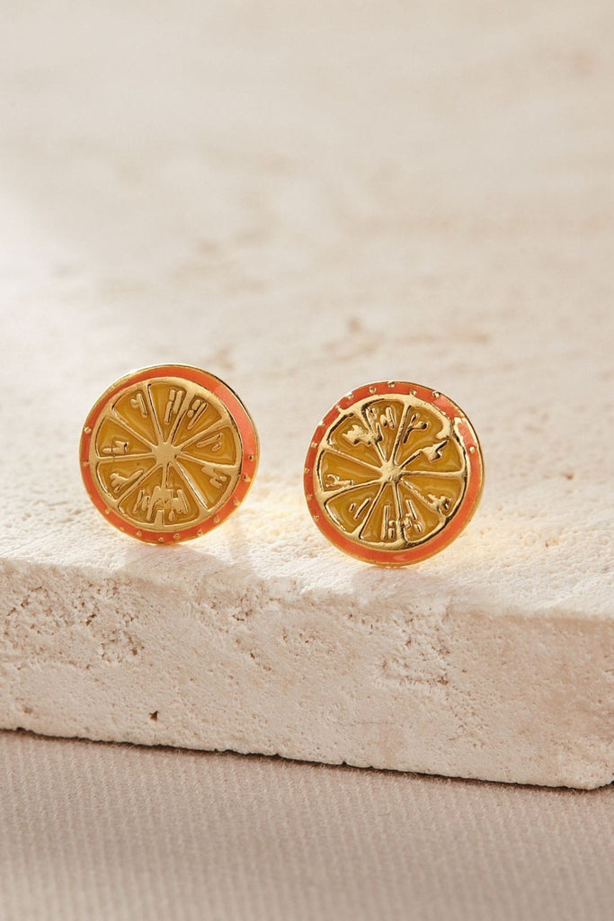 close up of the gold orange fruit studs showing the design detail