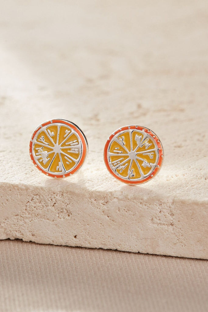 close up of the silver orange fruit studs showing the design detai