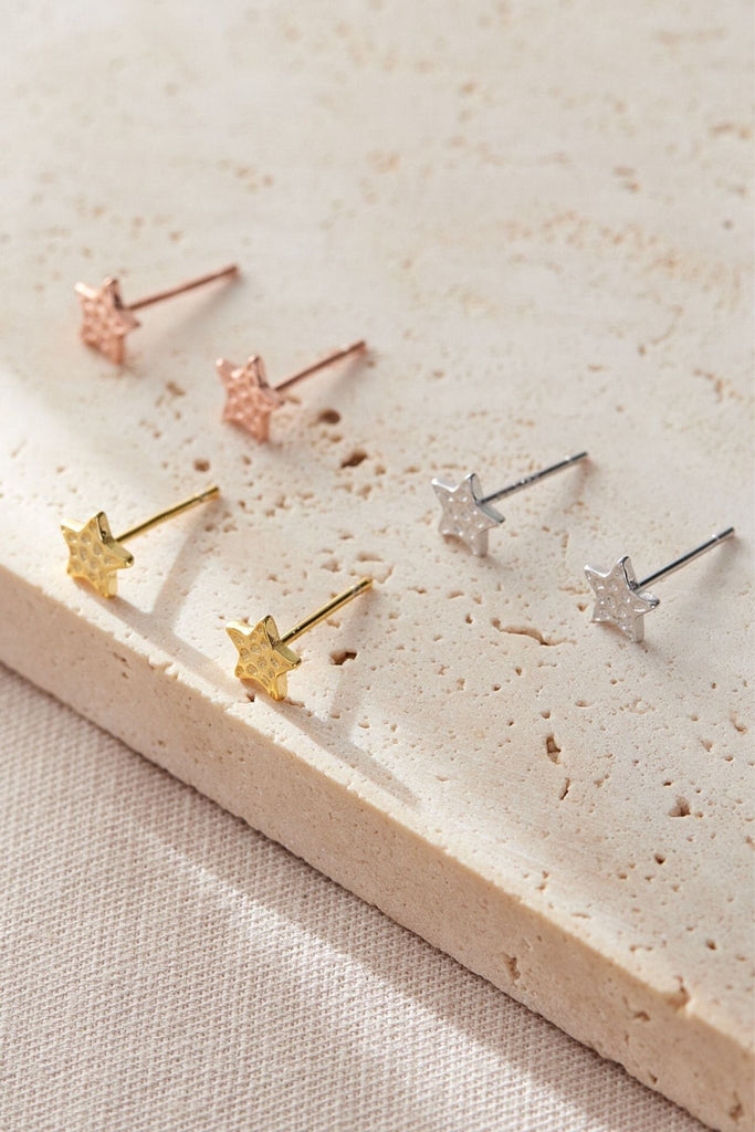 showing three colours of sterling silver hammered star stud earrings, silver, gold and rose gold