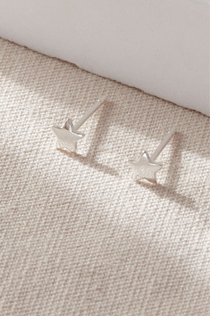 close up of the silver star earrings