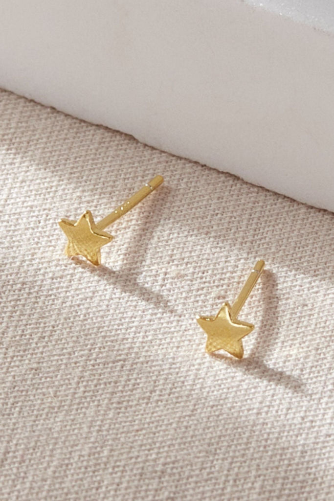 close up of the gold plated sterling silver star earrings