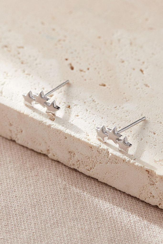 close up of the sterling silver triple star stud earrings