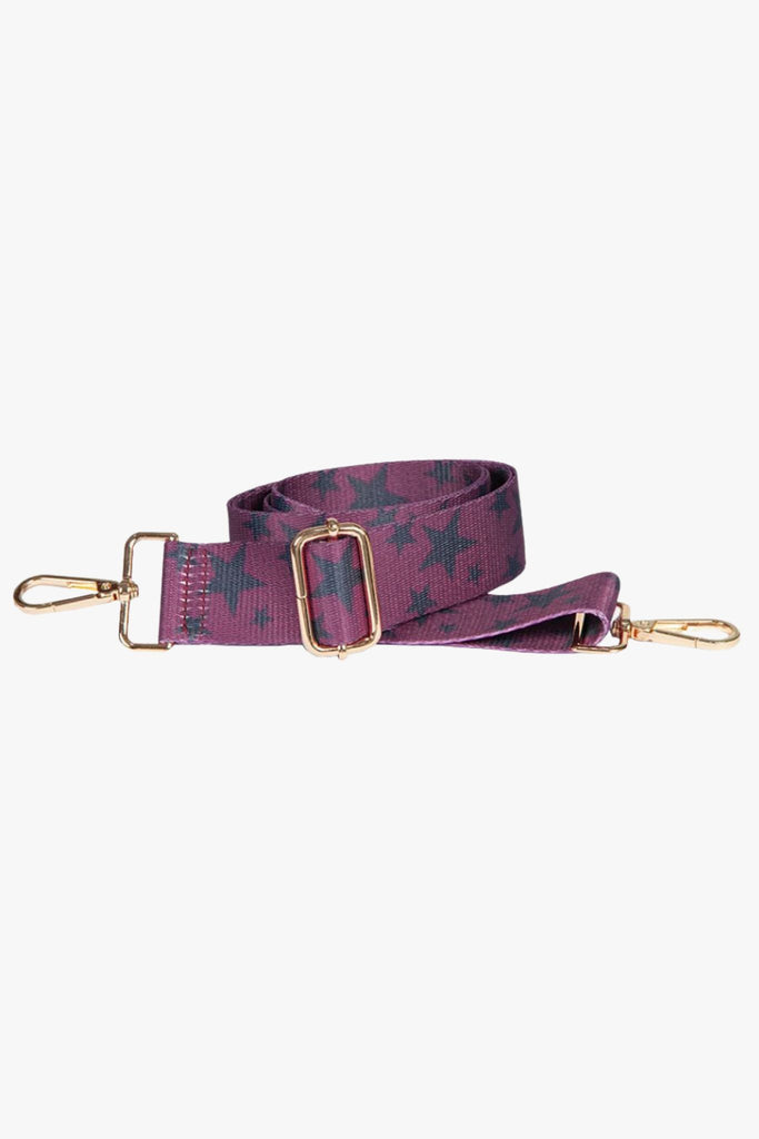 detachable bag strap with a scattered star pattern, in pink and black