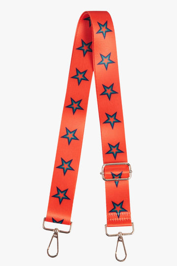 orange bag strap with a green star outline pattern