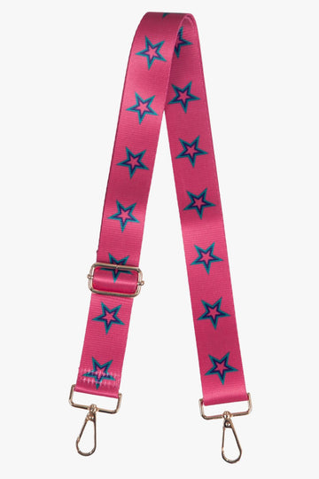 pink bag strap with a green star outline pattern, gold clip on hardware