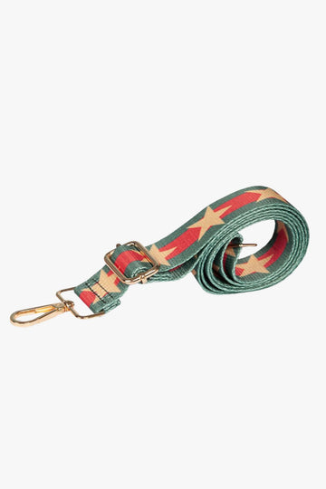 green and red bag strap with a gold star pattern down the middle