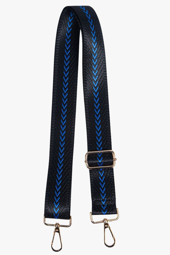 black bag strap with a blue chevron pattern and gold hardware