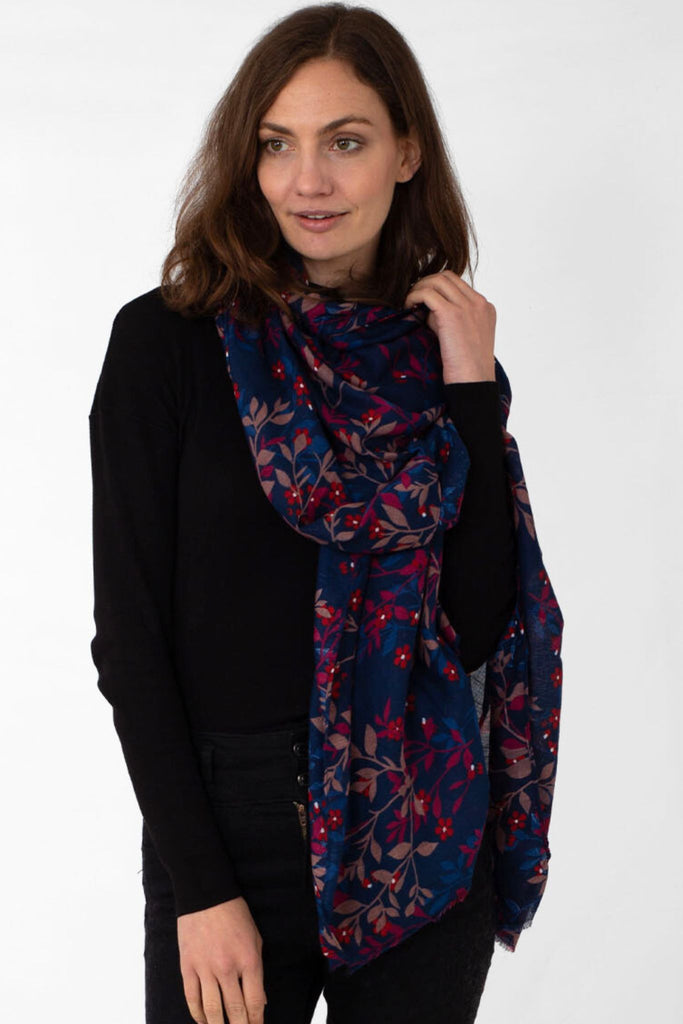 model wearing a navy blue and burgundy floral print lightweight scarf